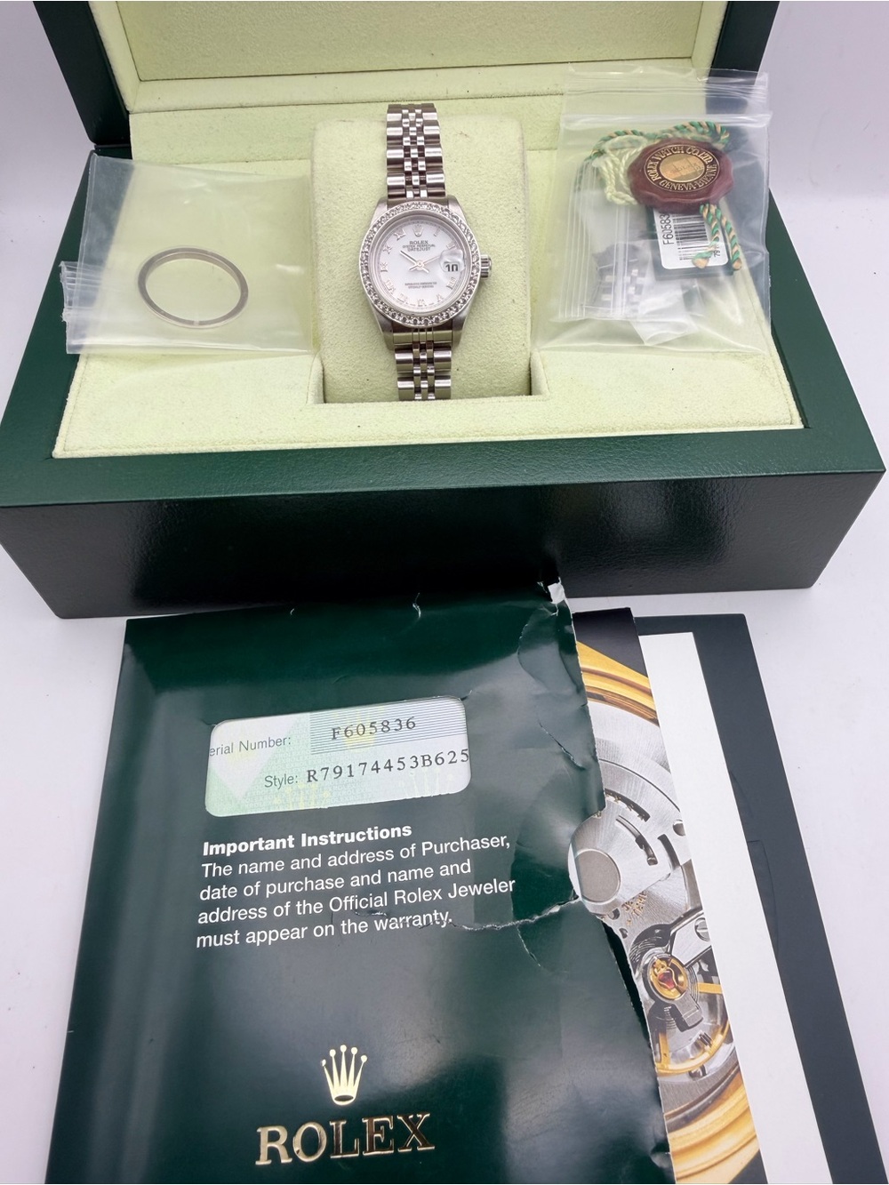 Rolex Silver Watch with White Dial and Diamond Bezel